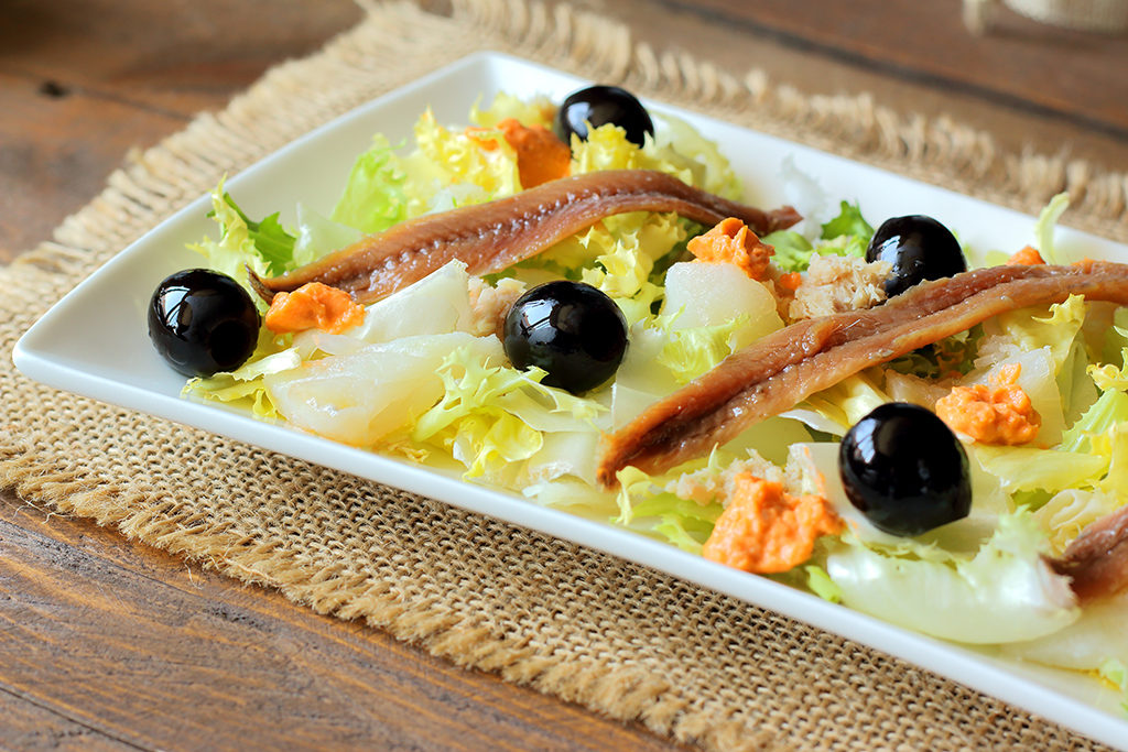 Cod, anchovies, and black olives salad